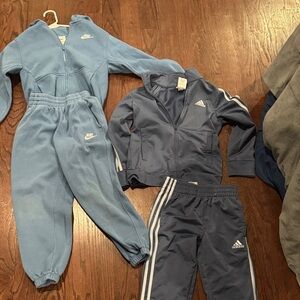 One nike, one adidas track suit size small